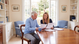 Parents reviewing estate-planning documents to help protect their children's inheritance from future financial risks
